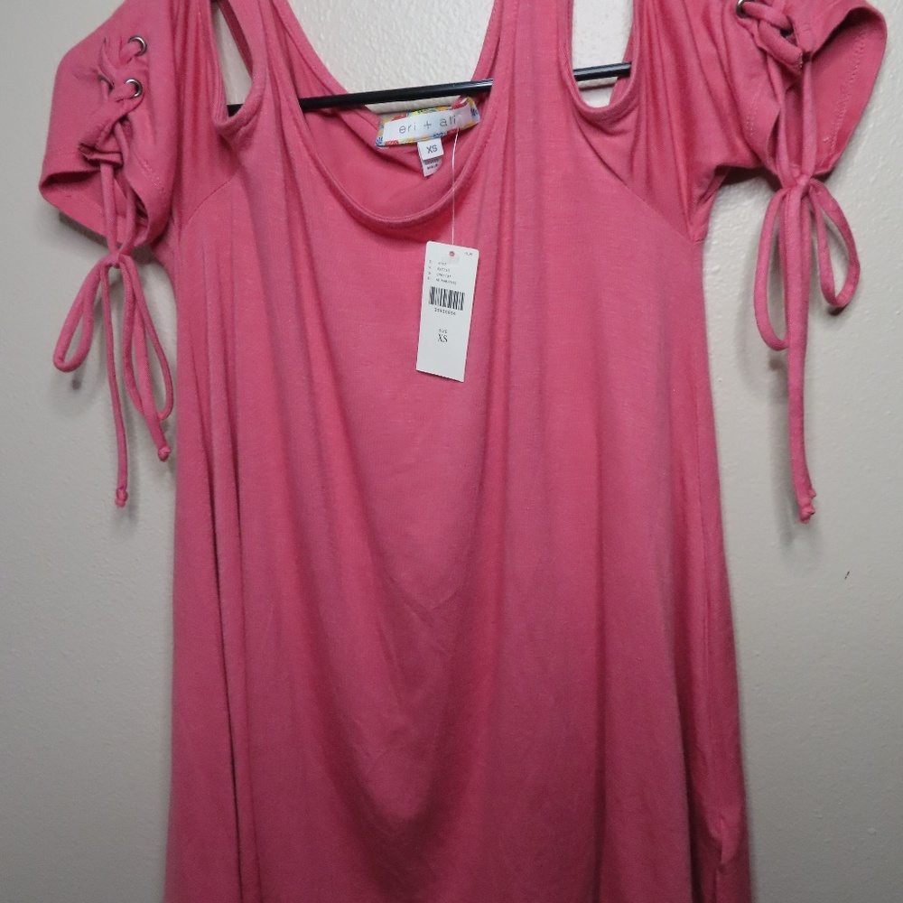 Pink sexy top hangs off shoulders